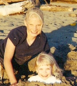 Abbey having fun in the sand with baby sis.